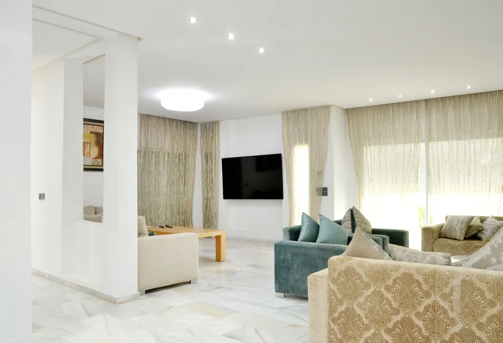 Spacious living room with elegant sofas and refined decor